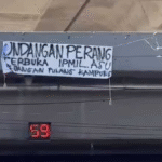Spanduk Bertuliskan “Perang Terbuka IPMIL ASU” Bikin Geger Pengguna Jalan di Fly Over Makassar