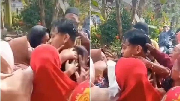 Tangkapan layar video memperlihatkan seorang pemuda yang sebelumnya disangka meninggal dunia akibat kecelakaan lalu lintas, tiba-tiba muncul dalam kondisi sehat dan menggegerkan rumah duka. Miskomunikasi Fatal, Jenazah Mr X Hampir Dimakamkan Orang yang Salah